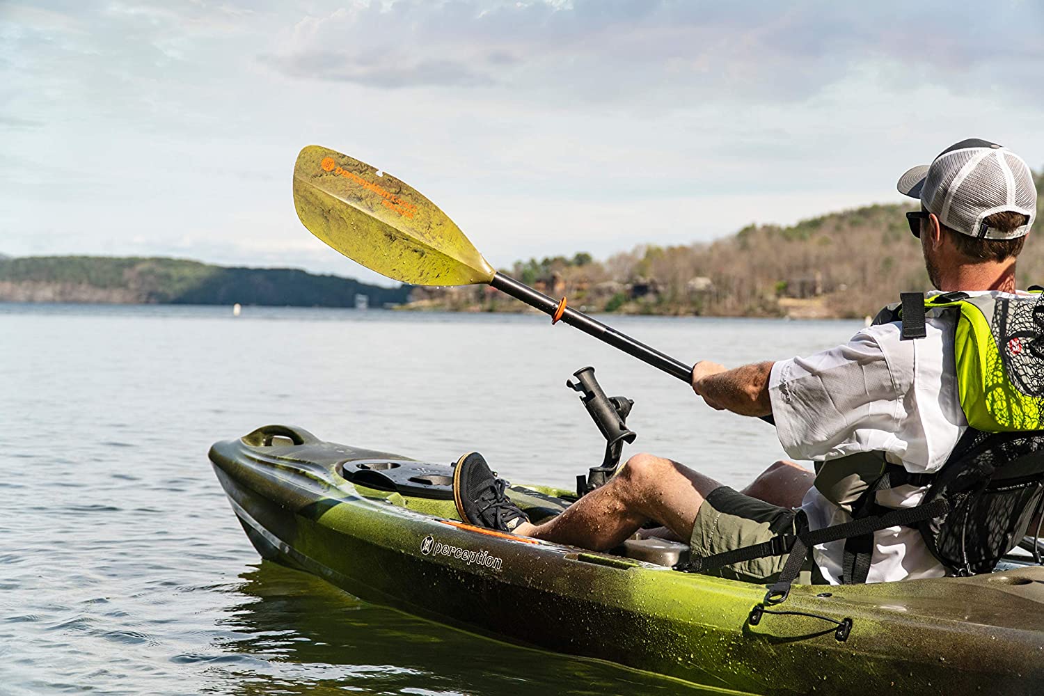man riding fishing kayak